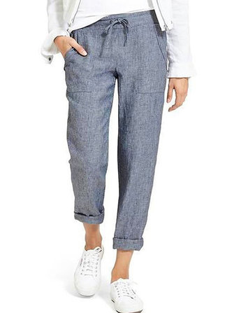 Damskie spodnie z bocznymi kieszeniami w pasie w czystym kolorze